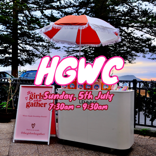 The Girls Who Gather Hot Girl Walk Club setup at Terrigal on the Central Coast, featuring the TGWG welcome sign and refreshment station before a free community walk for women to connect, stay active and make new friends.