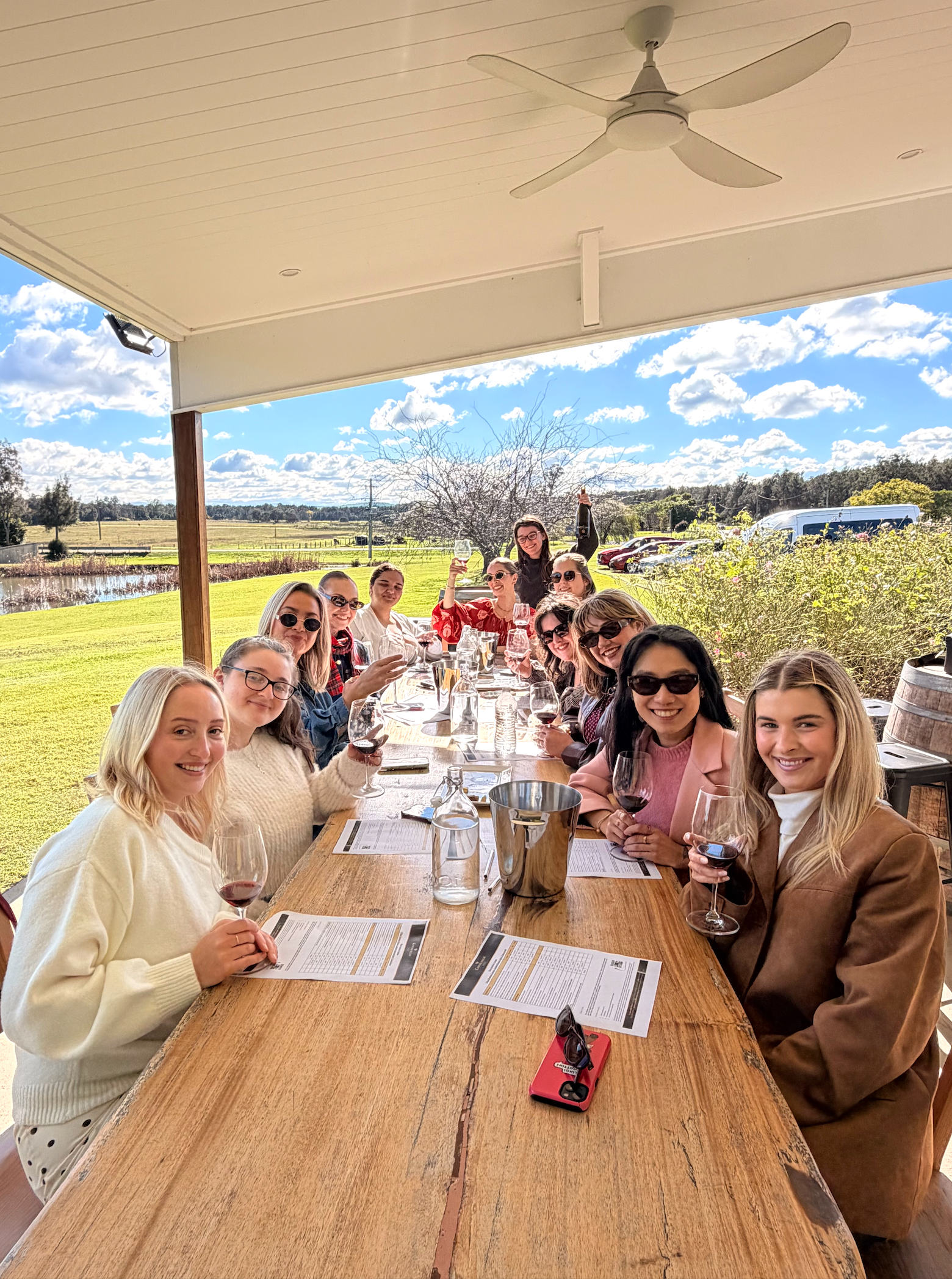 Women enjoying a Hunter Valley wine tasting experience with The Girls Who Gather and 77 Tours, showcasing memorable group travel experiences for women from the Central Coast.