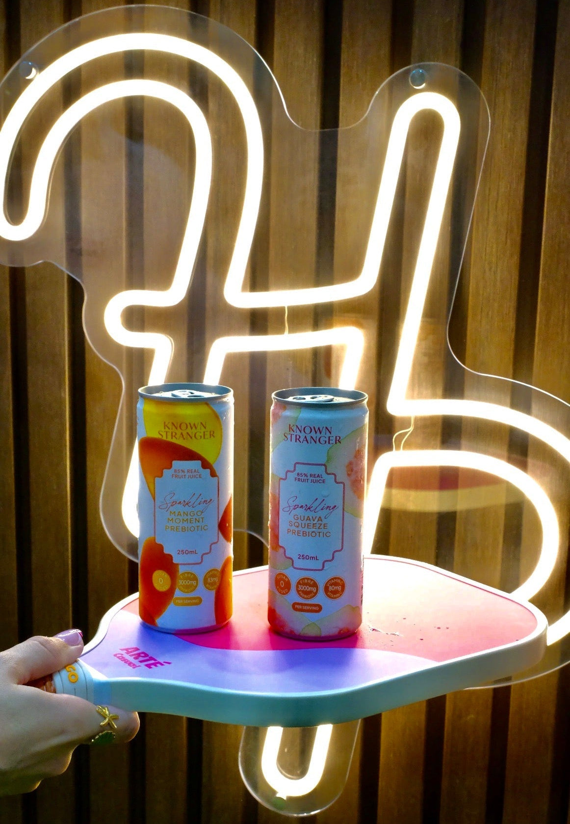 Known Stranger sparkling drinks served at a The Girls Who Gather women's community event on the Central Coast. Refreshments provided by a local sponsor during a social event designed to help women connect and build friendships.
