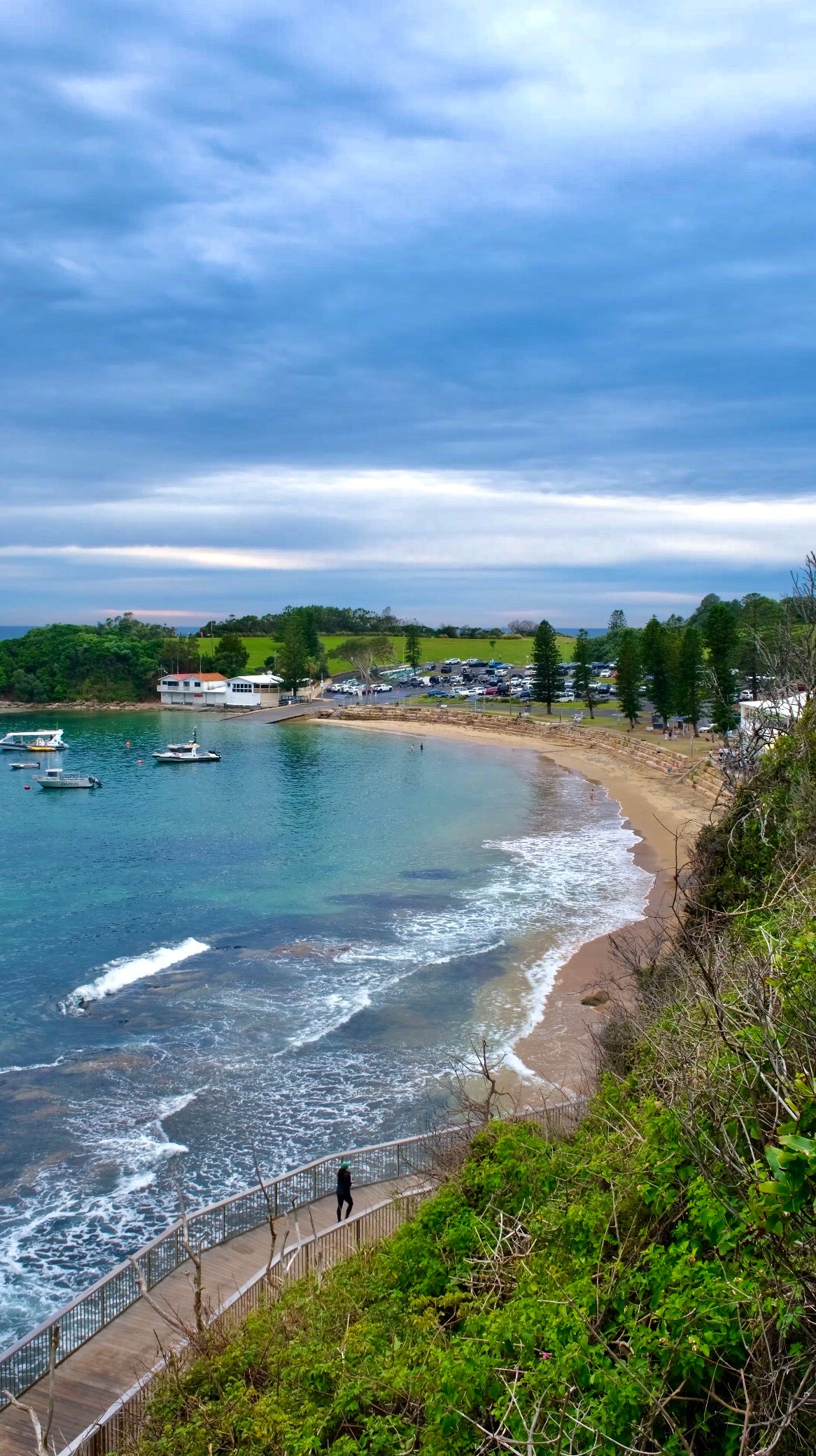 Scenic view of the Terrigal coastline on the Central Coast, NSW, overlooking the ocean, beach and coastal boardwalk. Popular location for The Girls Who Gather Hot Girl Walk Club and women's community events.